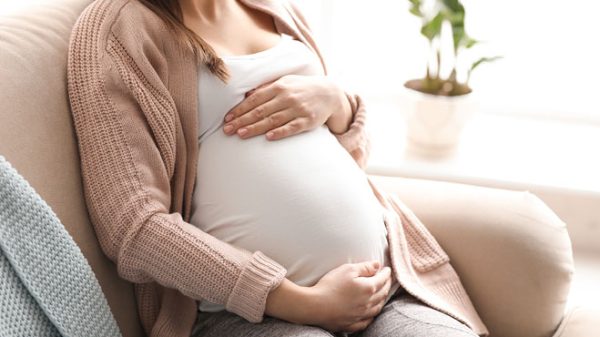 pregnant woman holding baby bump